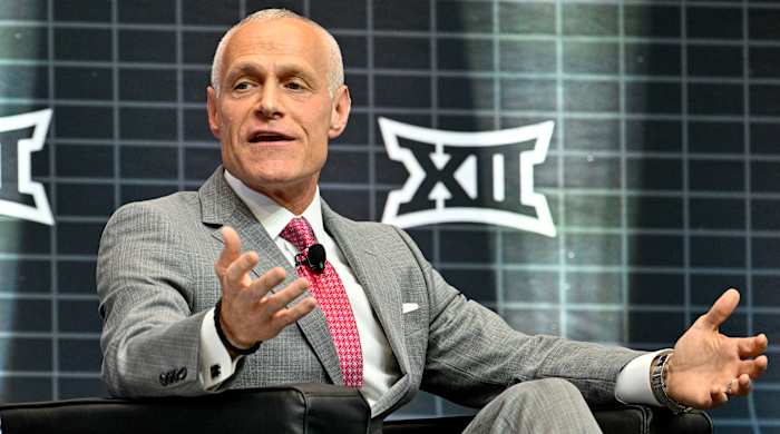 Big 12 commissioner Brett Yormark sits while speaking to press at Big 12 football media days.